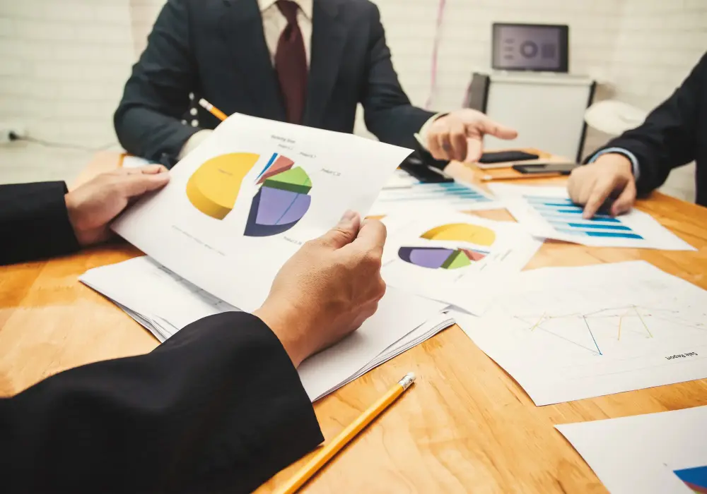 Professionals displaying financial infographics