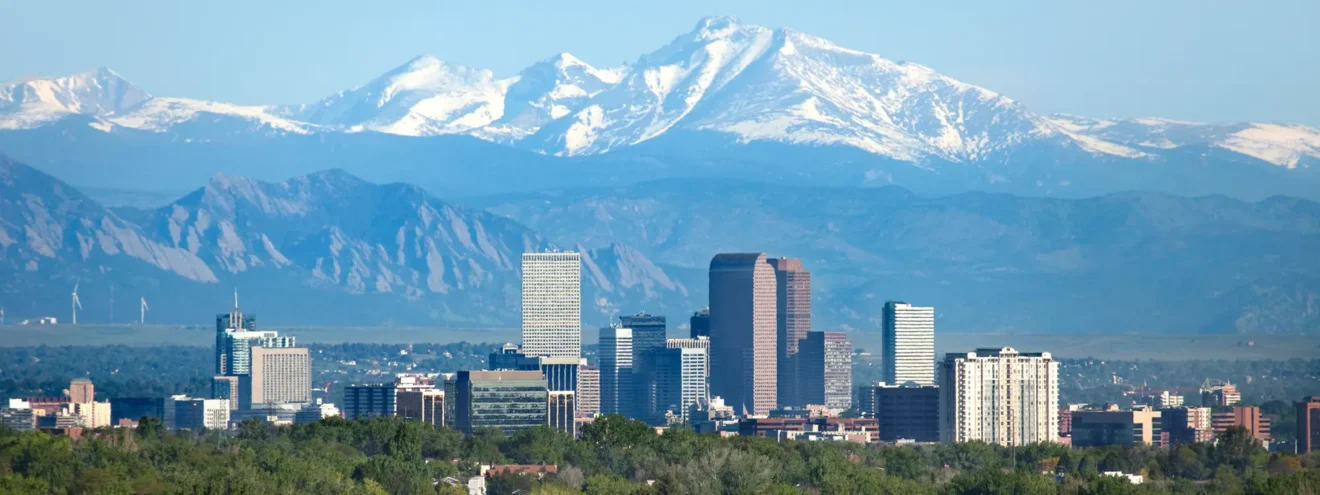 Beautiful view of downtown Denver, Colorado with the backdrop of the Rocky Mountains.