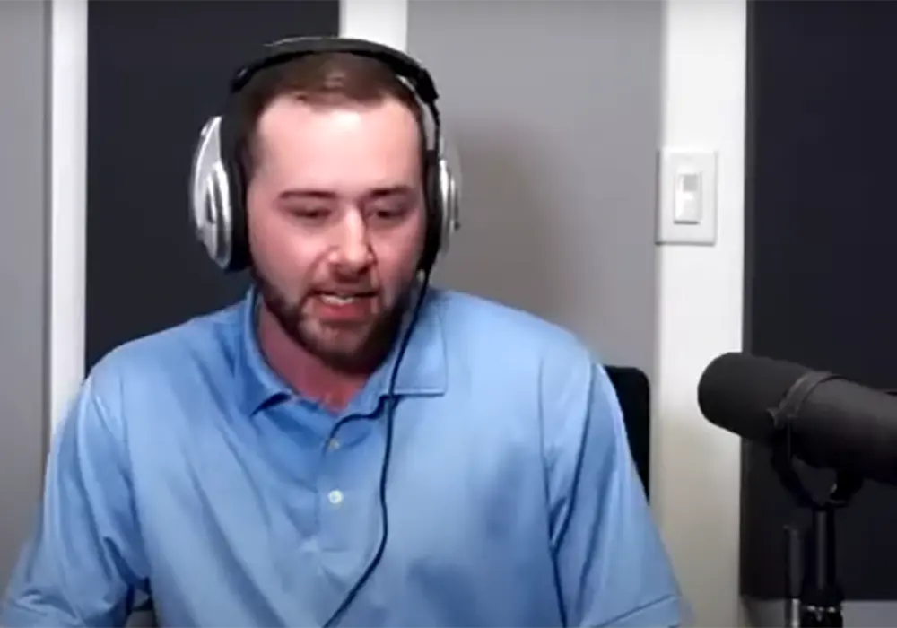 Mike Bernier with headphones broadcasting his webinar